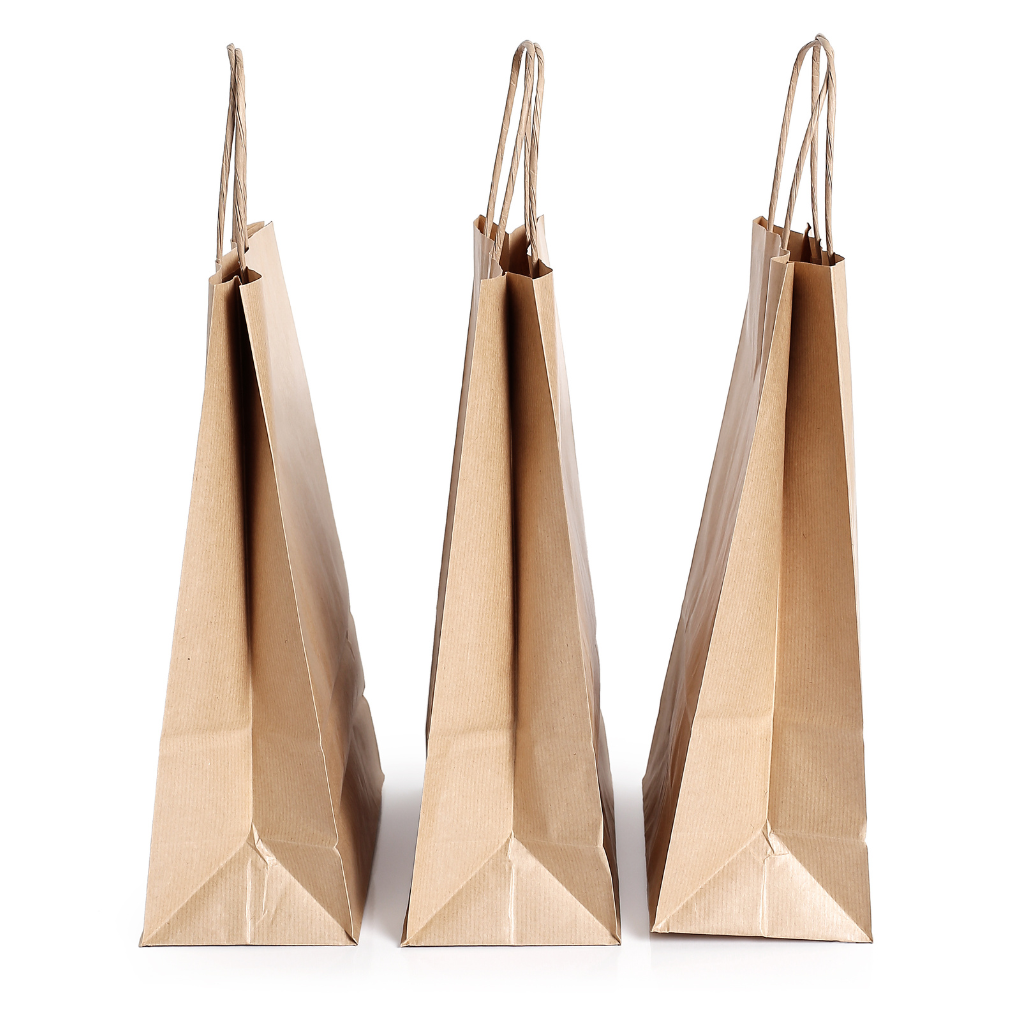 Various kraft paper products including envelopes, cups, and utensils